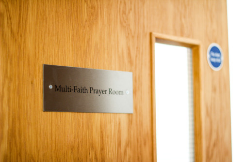 Image of plaque on door saying "multi-faith prayer room"